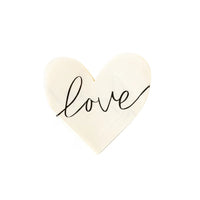 White heart-shaped napkins with black cursive love across the napkin - perfect for an anniversary party, a bridal shower or valentines day