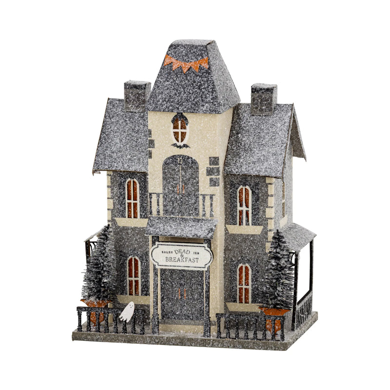 Dead & Breakfast light-up haunted house with glitter finish on a white background—vintage Halloween village decor.