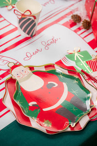 Close-up of scroll placemat next to Santa plate—large writing area for wish lists.