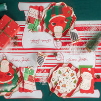 Product tile: stack of 12 scroll christmas placemats on green background.