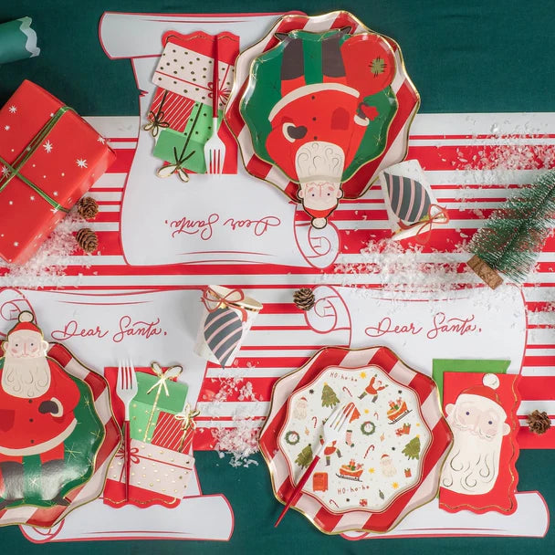 Product tile: stack of 12 scroll christmas placemats on green background.