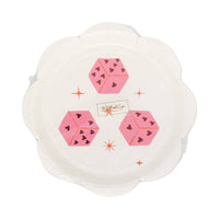 Scalloped plates featuring three pink heart dice and star accents in packaging