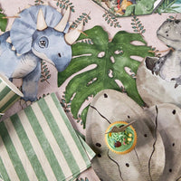 Dinosaur egg plates styled with cupcake and dinosaur party decor