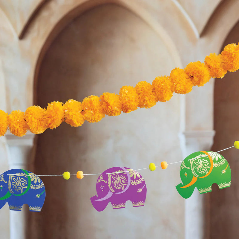 Colorful elephant garland with gold accents and pom-poms—easy diwali party decorations for home.