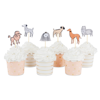 Dog cupcake toppers displayed on frosted cupcakes with coordinating baking cups