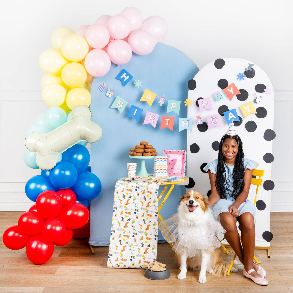 Dog themed party setup with balloon arch and Dog Party Table Runner