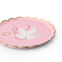 Stack of pink dove small plates with scalloped gold rim