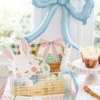 Easter basket plate styled in spring tablescape with bunny plates and pastel decor