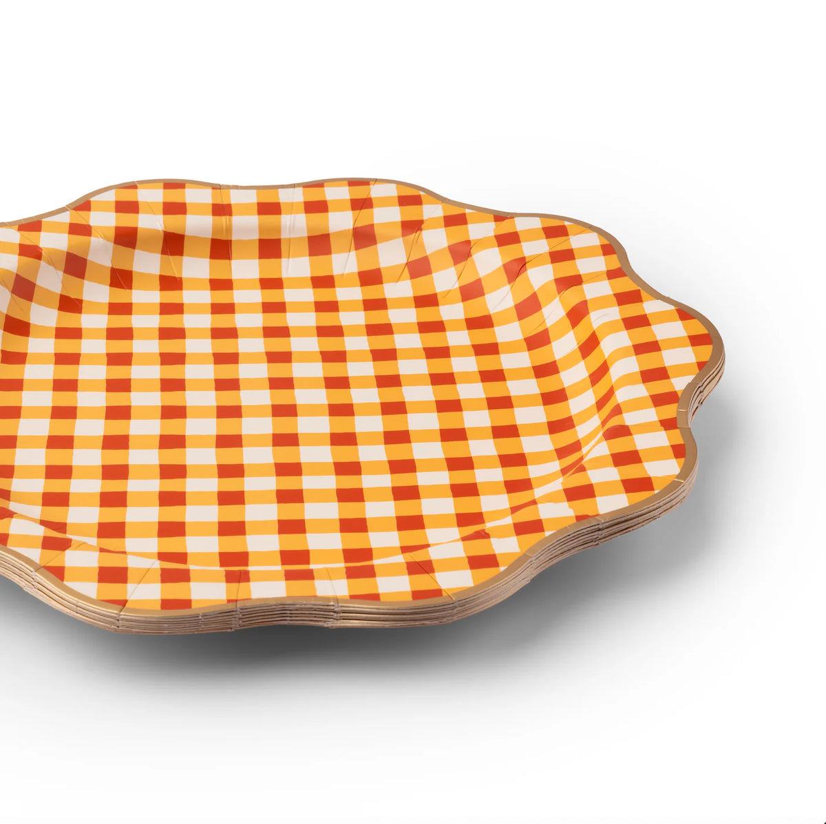 Side angle of the plate showing scalloped/decagon edge and metallic gold rim.