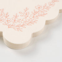 Macro shot of the premium embossed paper texture and scalloped border