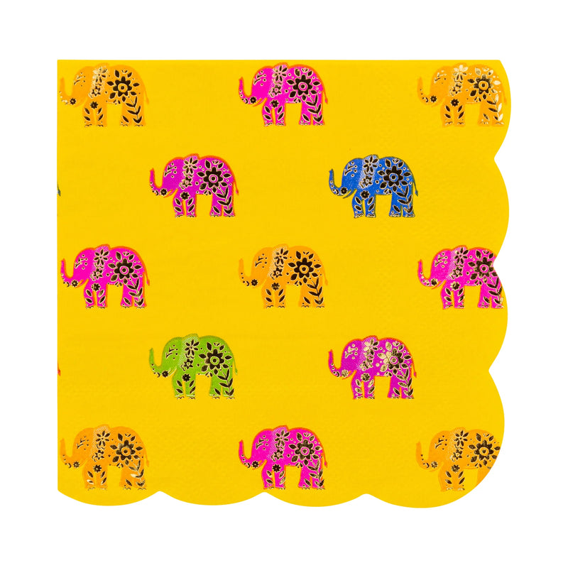 Close-up of foil elephant pattern with scalloped edge on marigold napkin.
