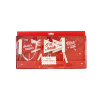 Front retail package of Elf Mini Felt Pennant Flags with five holiday designs in red and white.