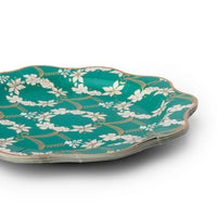 Emerald green Rococo dinner plate shown at an angle