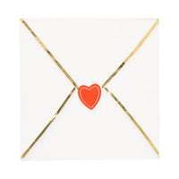 Envelope shaped dinner napkin with red heart seal and gold foil details