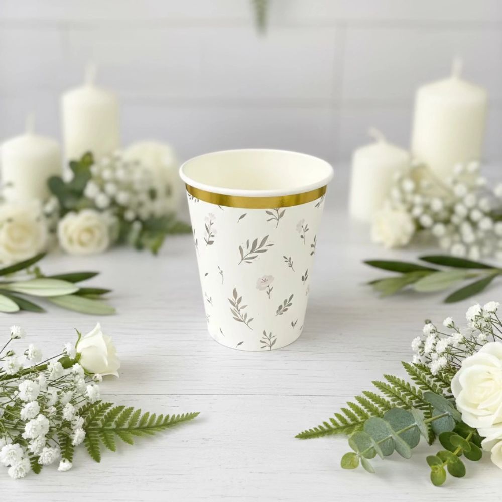 eucalyptus floral paper cup with candles and flowers background
