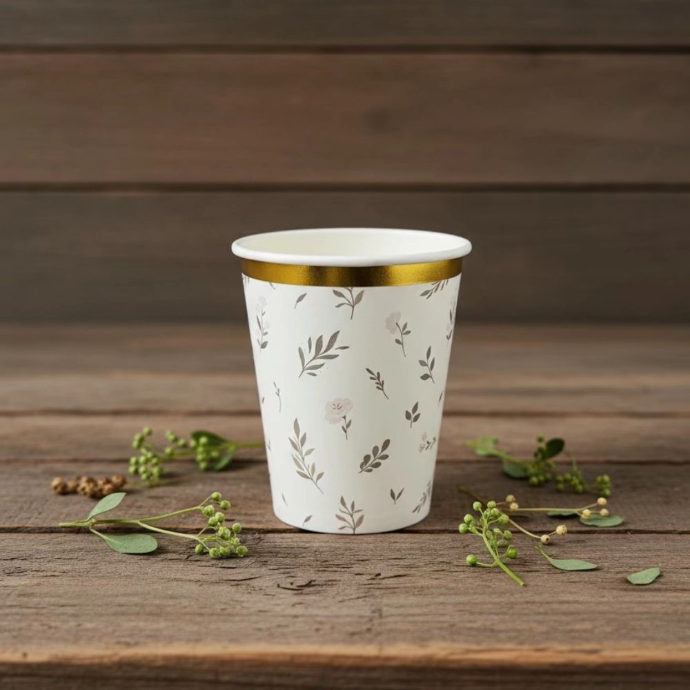 eucalyptus cup on wooden table with greenery accents
