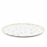 side view of eucalyptus greenery paper plate with gold trim
