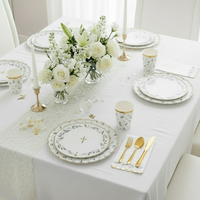 botanical table setting with eucalyptus plates and gold cutlery