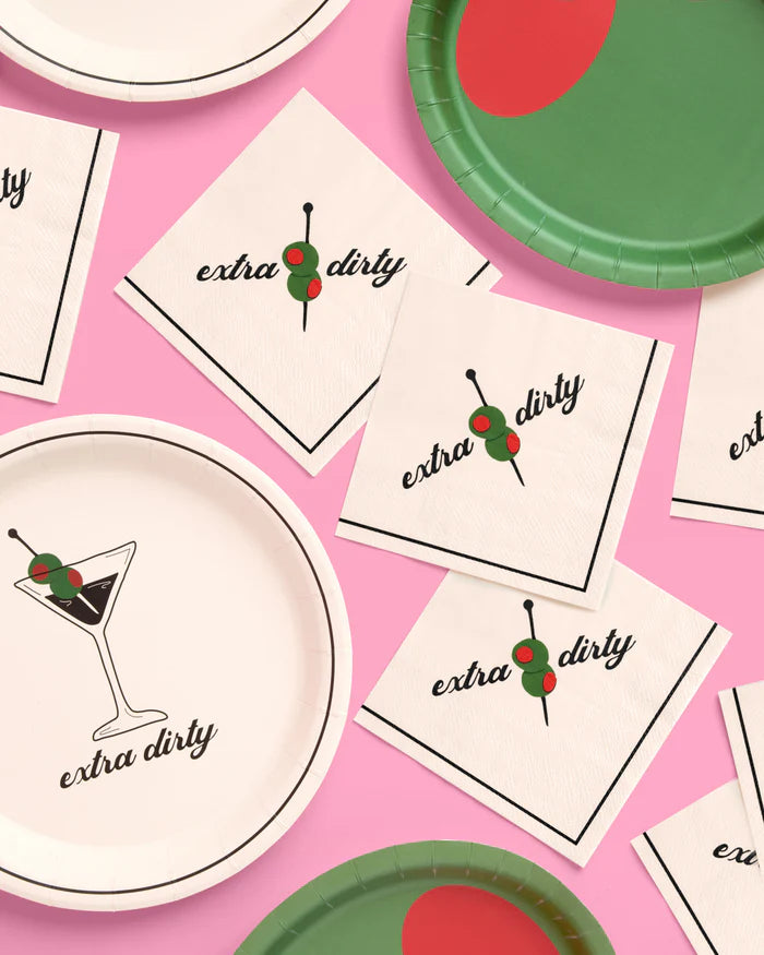 Extra dirty martini napkins with matching martini plates and green party plates on a pink background