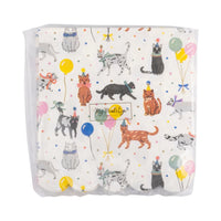 Reverse side of the napkin bundle showing the full dancing-cat print through the clear wrapper, no white product label.