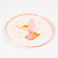 Angled view of pink fairy plate with stars.