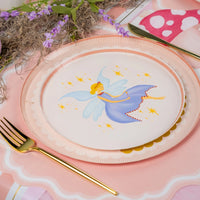 Close-up of blue-wing fairy plate on pink runner.