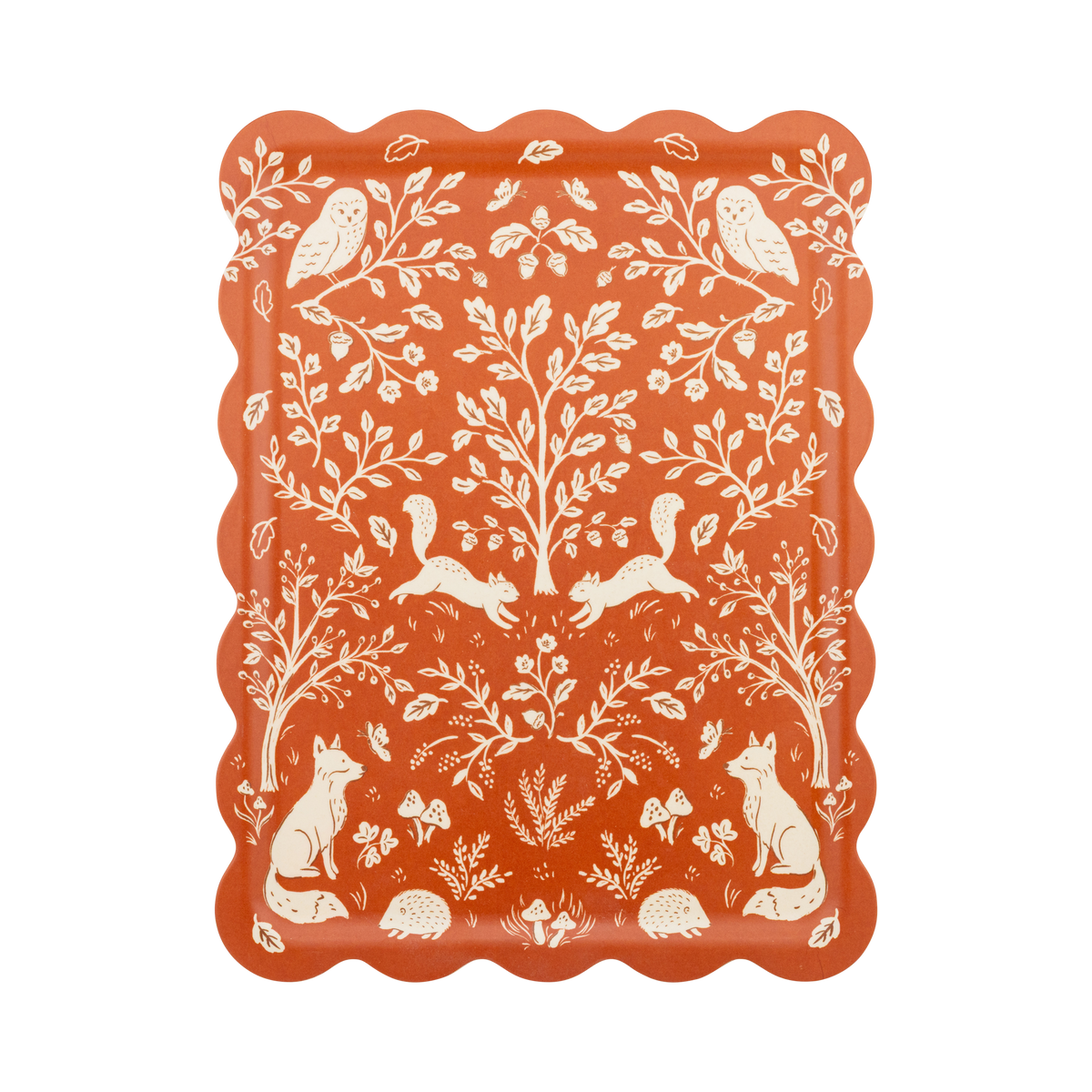 Fall bamboo serving tray in rust and cream with a scalloped edge and folk-art woodland illustration of deer, birds, acorns, and oak leaves, overhead view on white background.