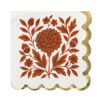 Cream cocktail napkin with orange floral design and a gold foil scalloped edge, front view.