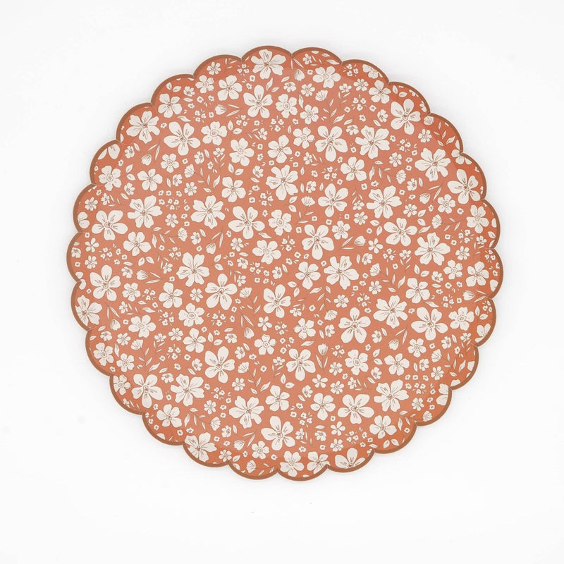 Rust fall floral scalloped paper dinner plate with cream flowers on a terracotta ground
