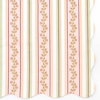 Close-up of a fall harvest floral cocktail napkin showing vertical stripes in cream, blush pink, peach, sage green, and burgundy with climbing gold floral vines and a wavy scalloped edge.