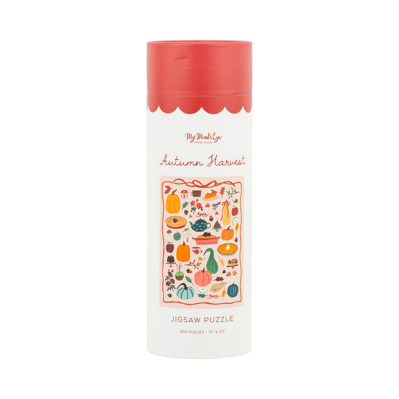Fall harvest jigsaw puzzle box, cream with a scalloped pink lid, showing the colorful autumn illustration and "Autumn Harvest" label, front view.