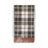 Plaid-patterned paper napkin packaging on a white background. 
