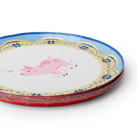 Close-up of a pink pig Countryside farm animal plate with a red quiltwork-star rim