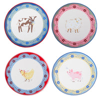 Four Countryside farm animal small plates with a cow, chicken, sheep, and pig in a quiltwork-star rim
