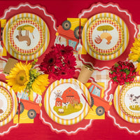 Overhead spread of coordinated farm table settings for kids.
