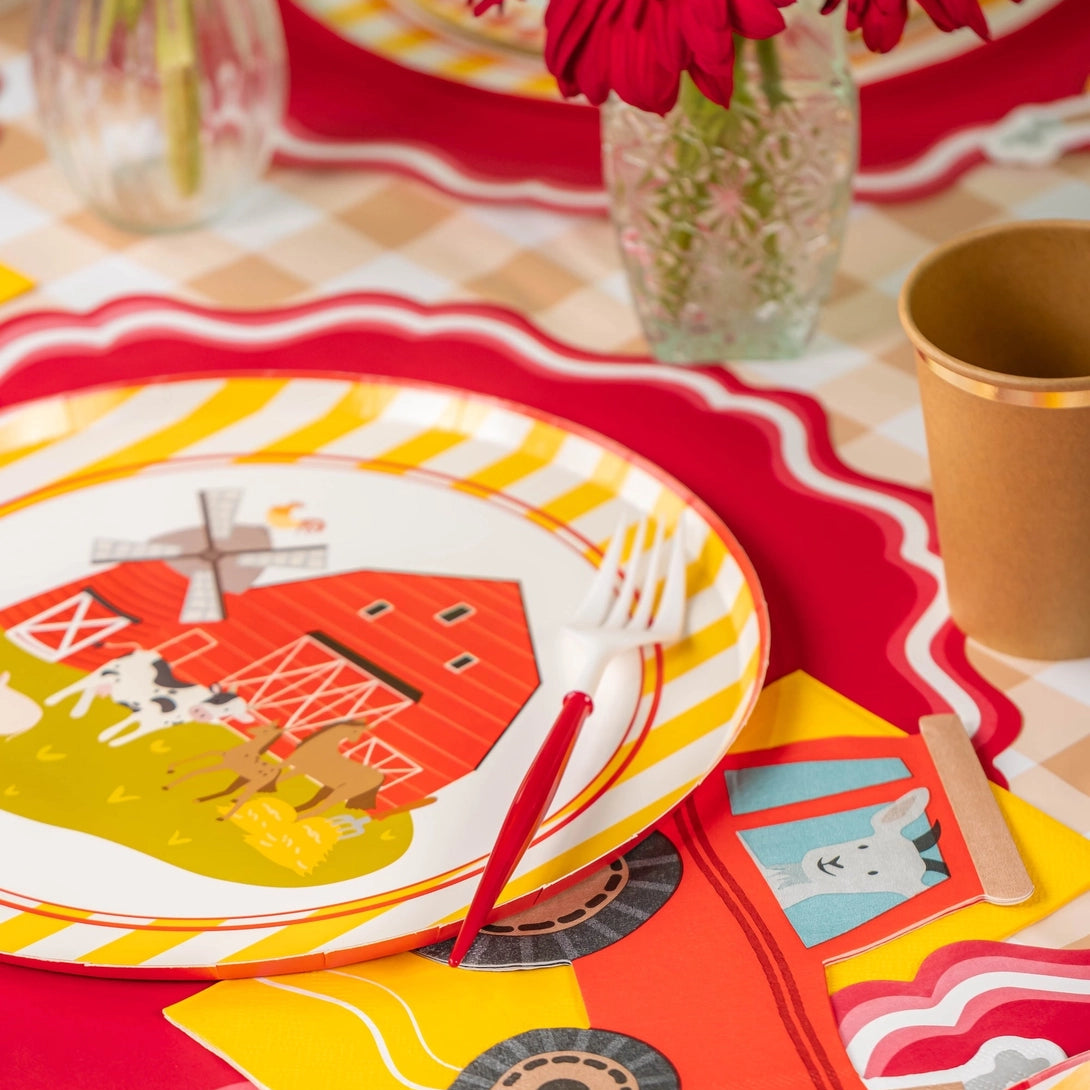 Place setting with tractor napkin and farm dinner plate.