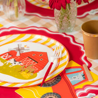 Place setting with tractor napkin and farm dinner plate.