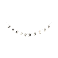 Decorative string with small black and white halloween ghost figures on a white background. 