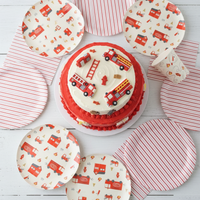 Firetruck plates arranged around birthday cake.