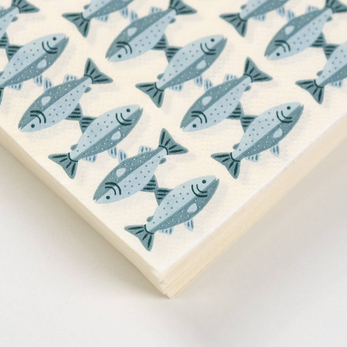 Close-up of the blue spotted-trout print on a fish print paper guest towel.