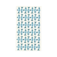 Cream paper guest towel with an all-over hand-drawn blue spotted-trout print, shown flat on a white background.