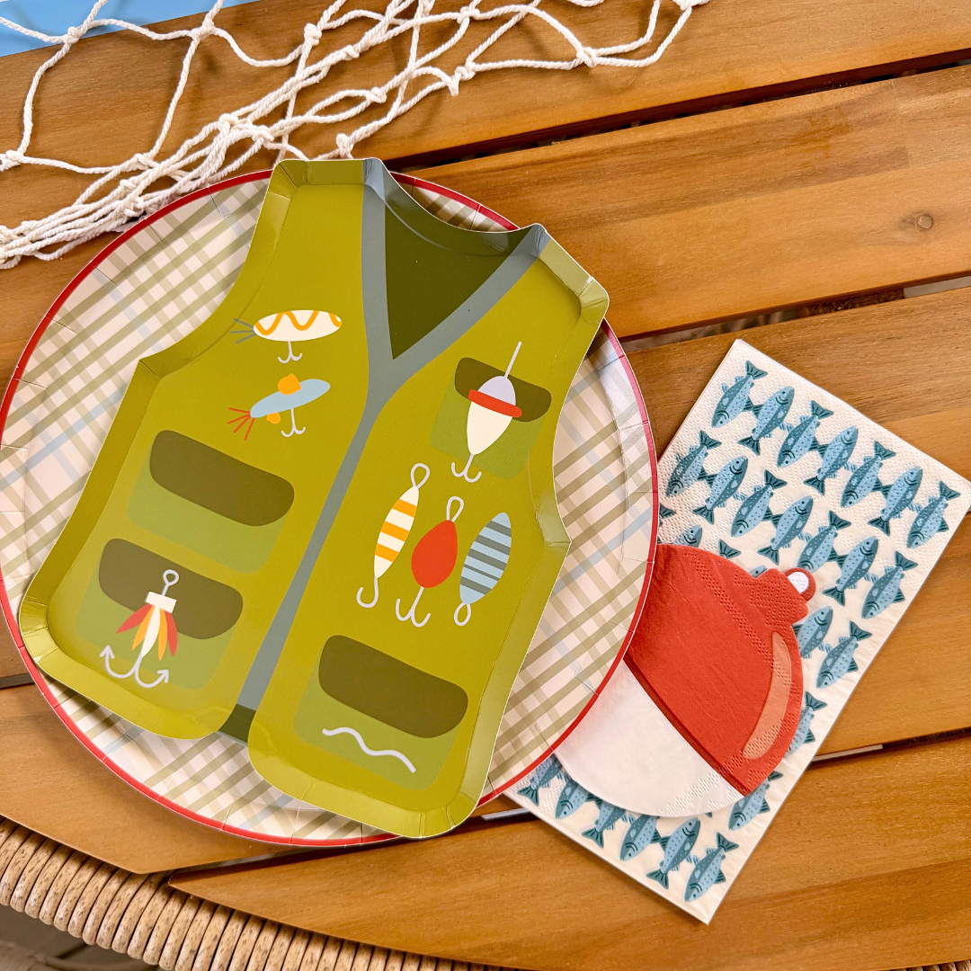 Fishing party place setting with vest shaped paper plate, plaid dinner plate, fish napkin, and scalloped placemat