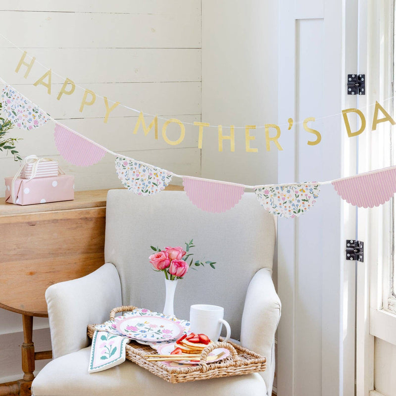 Floral border napkin styled with Mother's Day brunch and banner