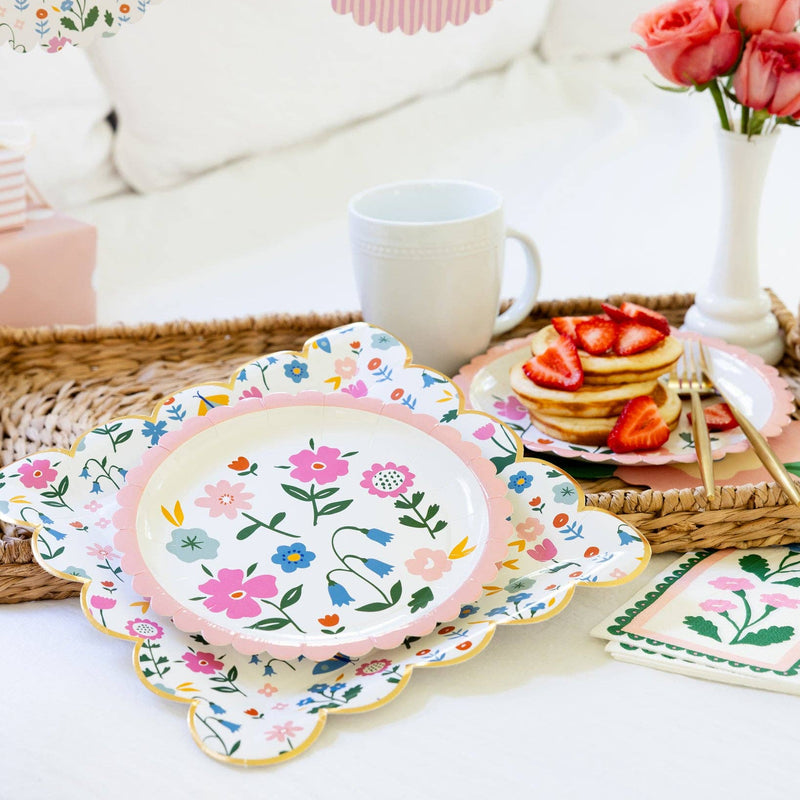 Floral scalloped plates styled on a brunch tray with pancakes and spring tableware