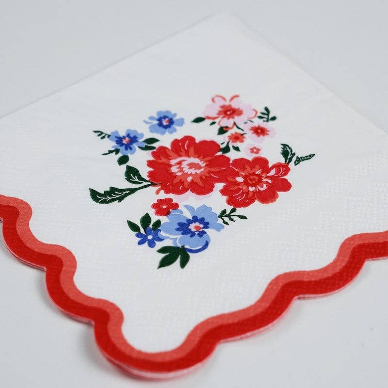 Close-up of the vintage-style red and blue floral print on a premium 3-ply paper napkin.
