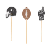 Football food picks featuring helmet, football, and #1 hand designs on wooden sticks, perfect for game day and football party snacks