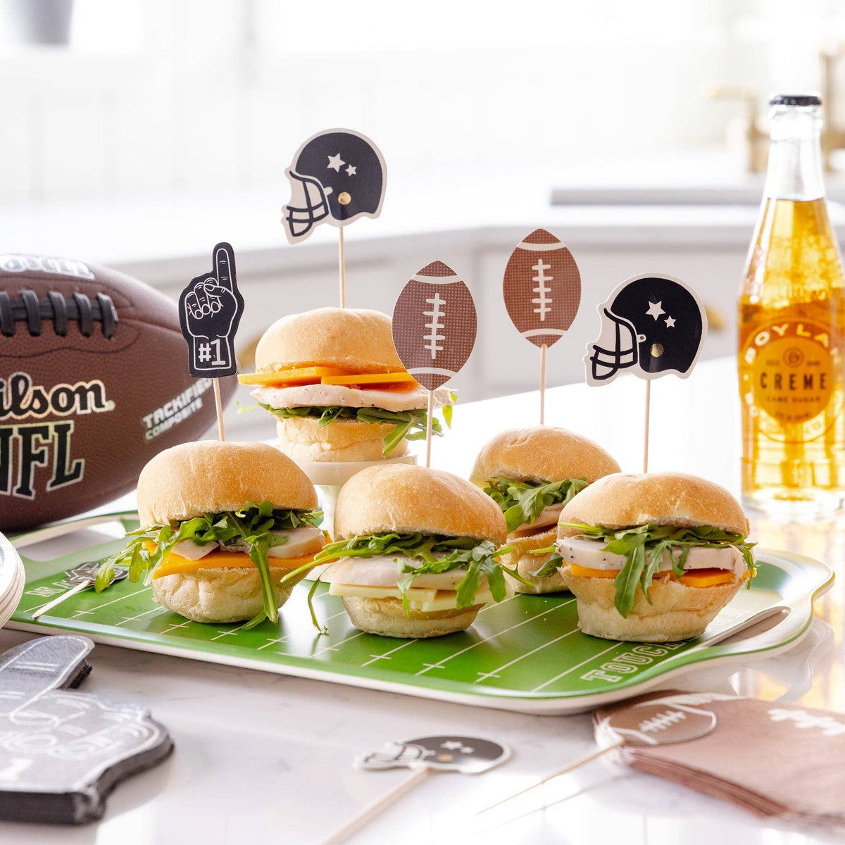 Football food picks used on sliders for a game day party, tailgate, or football-themed birthday table
