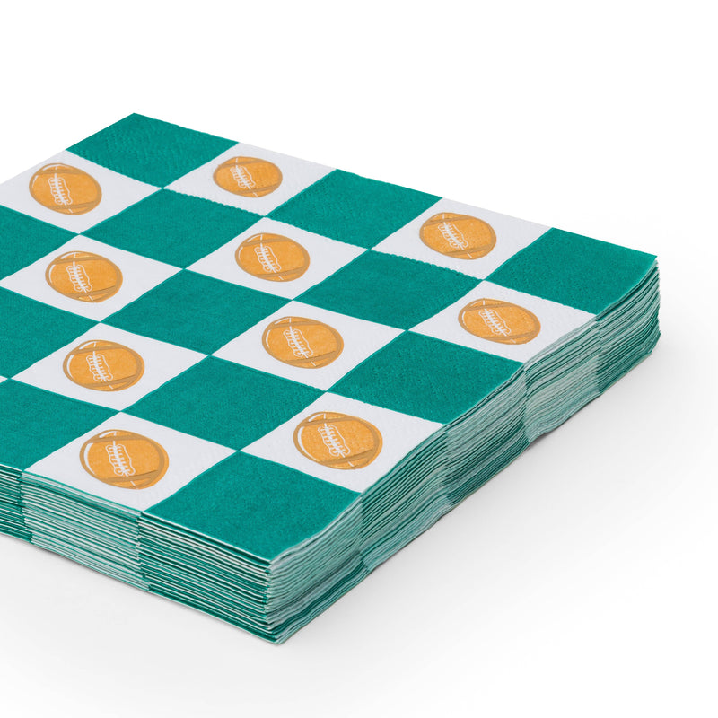 Stack of football and green checker lunch napkins for game day parties

