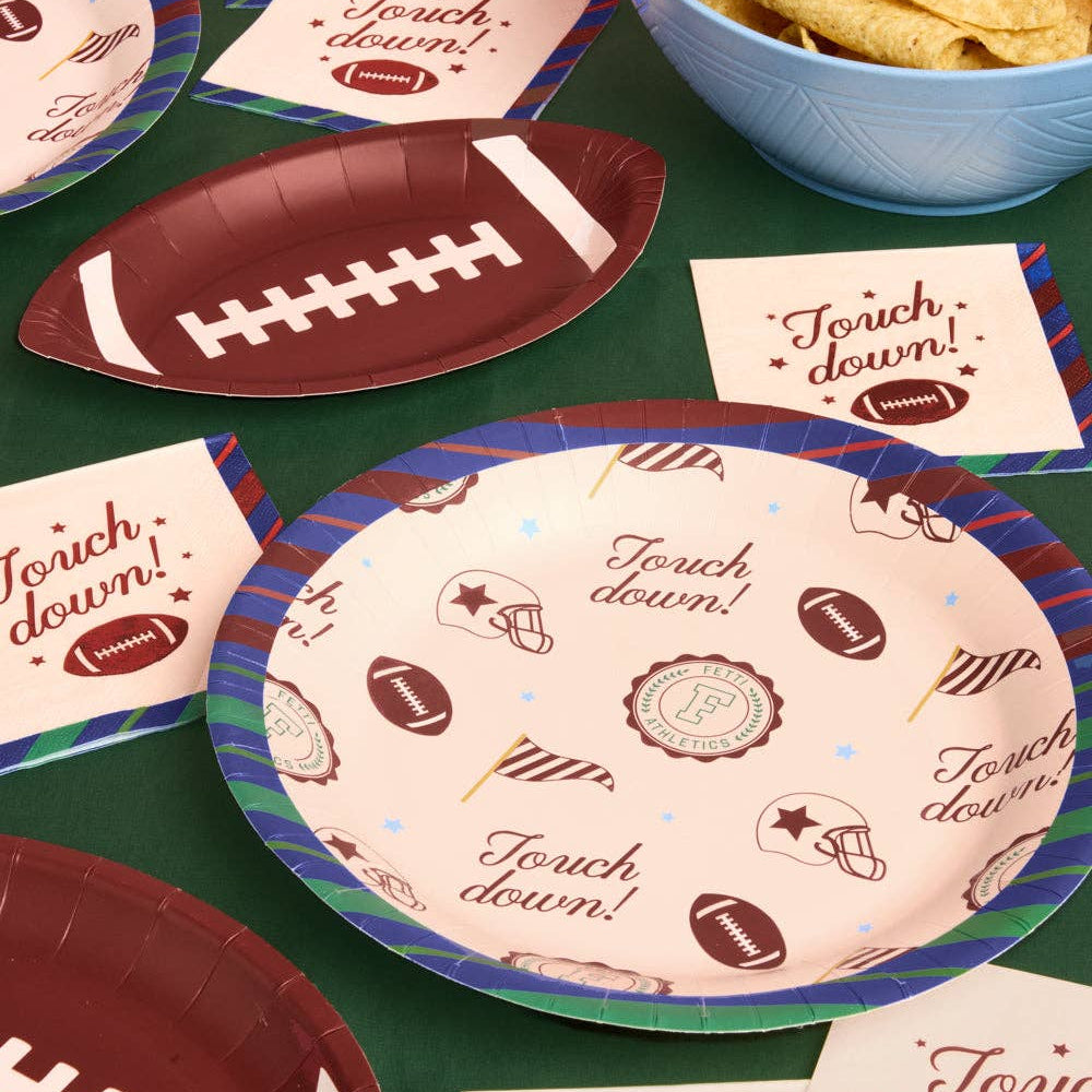Varsity football party plates styled on a game day snack table