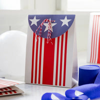 Close-up of a patriotic treat bag tied with red and white baker’s twine, great for filling with candy or small toys.